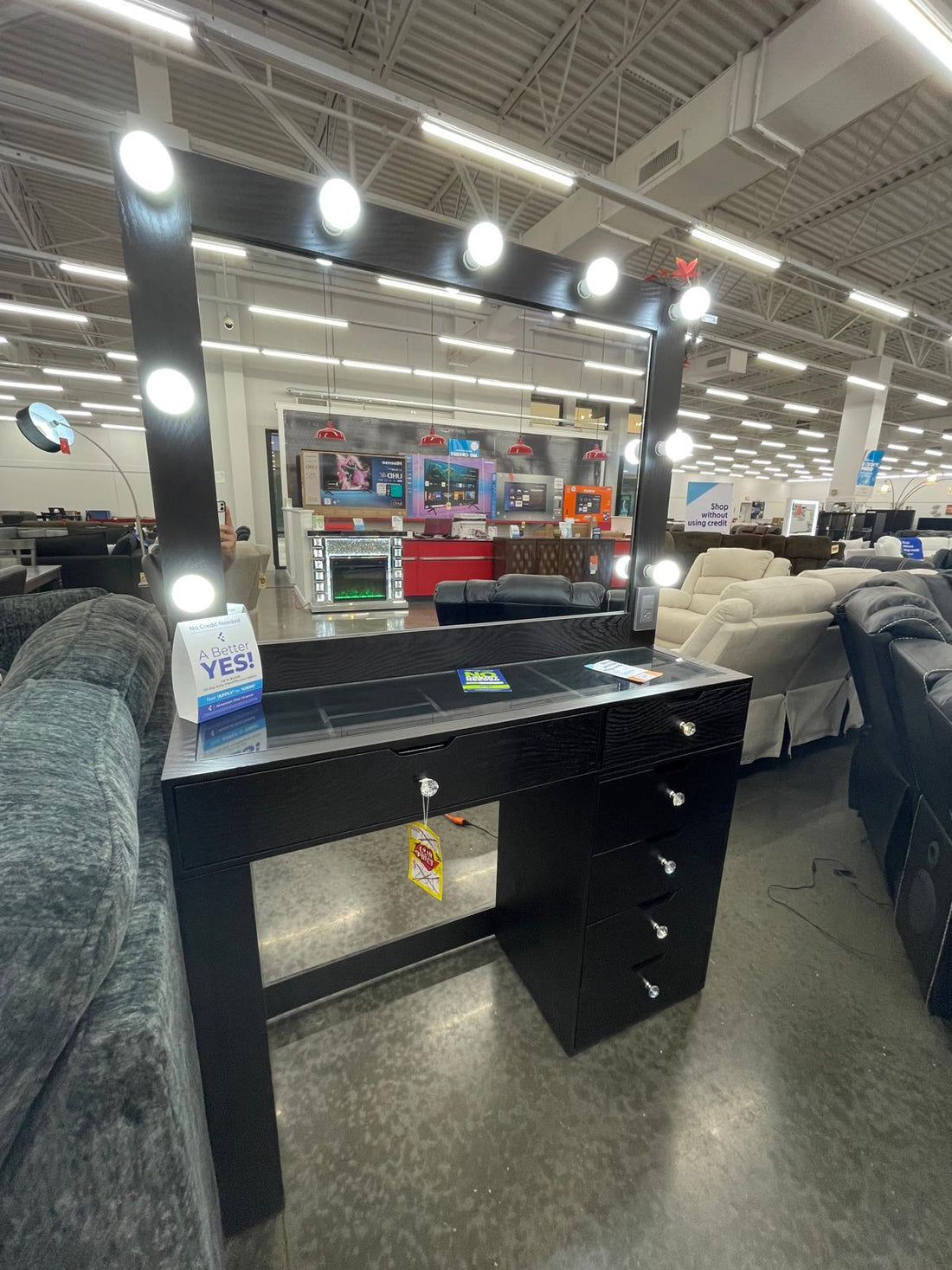 Black Vanity Mirror Set, Rectangular mirror with light bulbs lining the top and sides & Five drawers with silver knobs