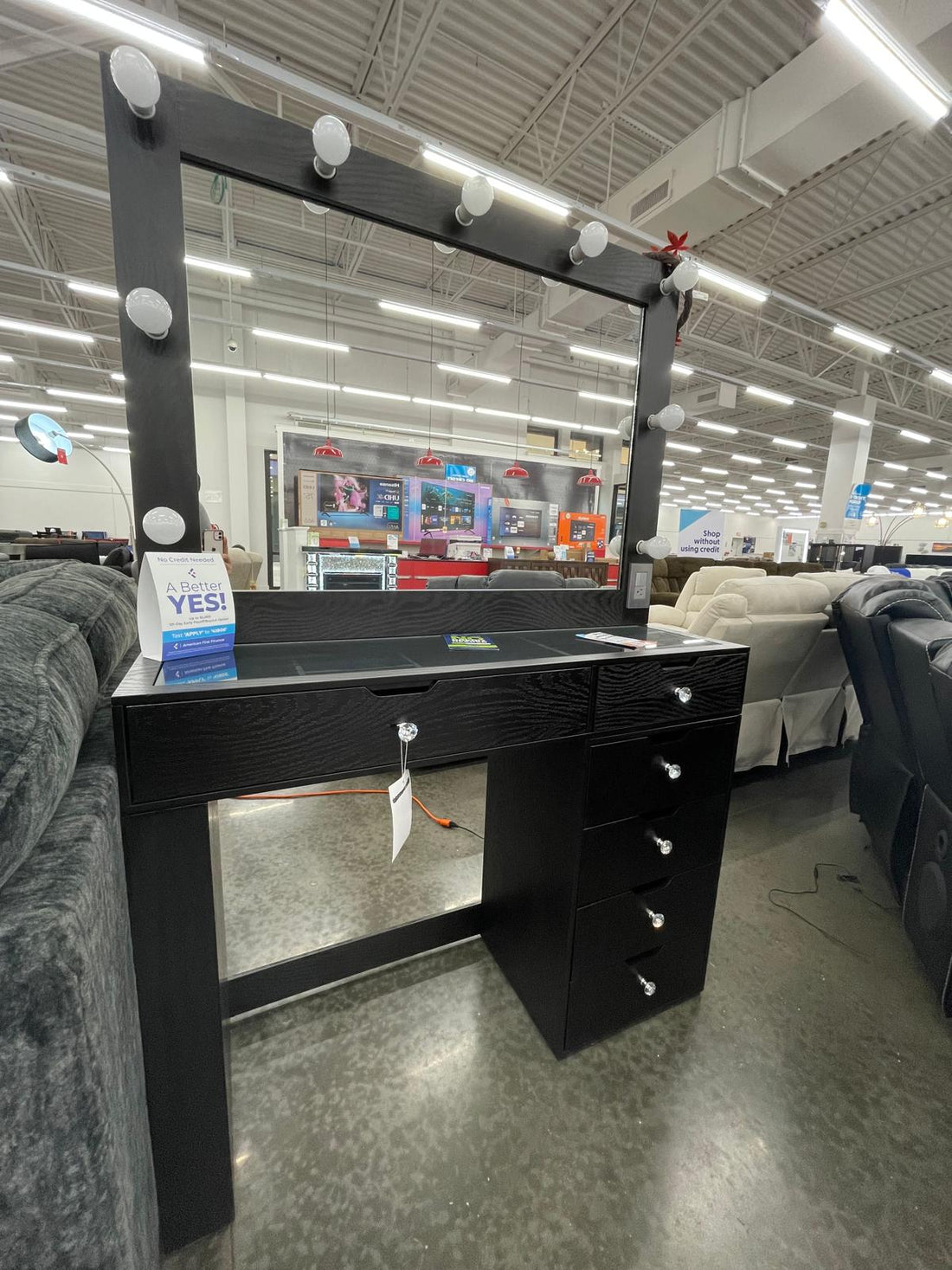 Black Vanity Mirror Set, Rectangular mirror with light bulbs lining the top and sides & Five drawers with silver knobs