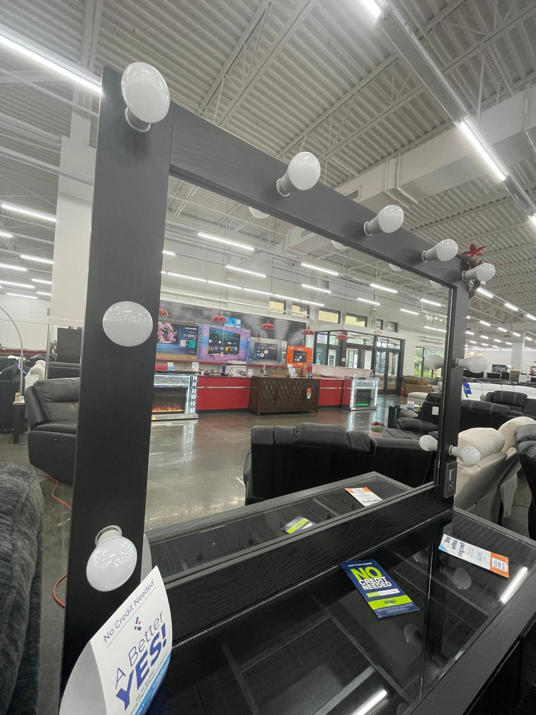 Black Vanity Mirror Set, Rectangular mirror with light bulbs lining the top and sides & Five drawers with silver knobs