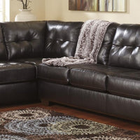 Signature Design by Ashley Rich Durable upholstery surrounds the contemporary sectional sofa